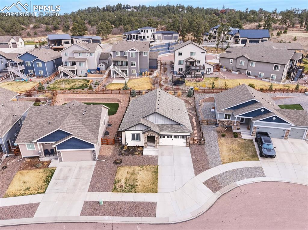 Image 47 of 50: Elevated aerial showcasing the home’s position within the neighborhood, bac