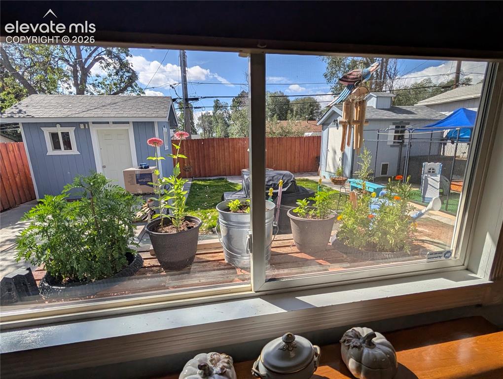 Image 13 of 20: view to the backyard from kitchen