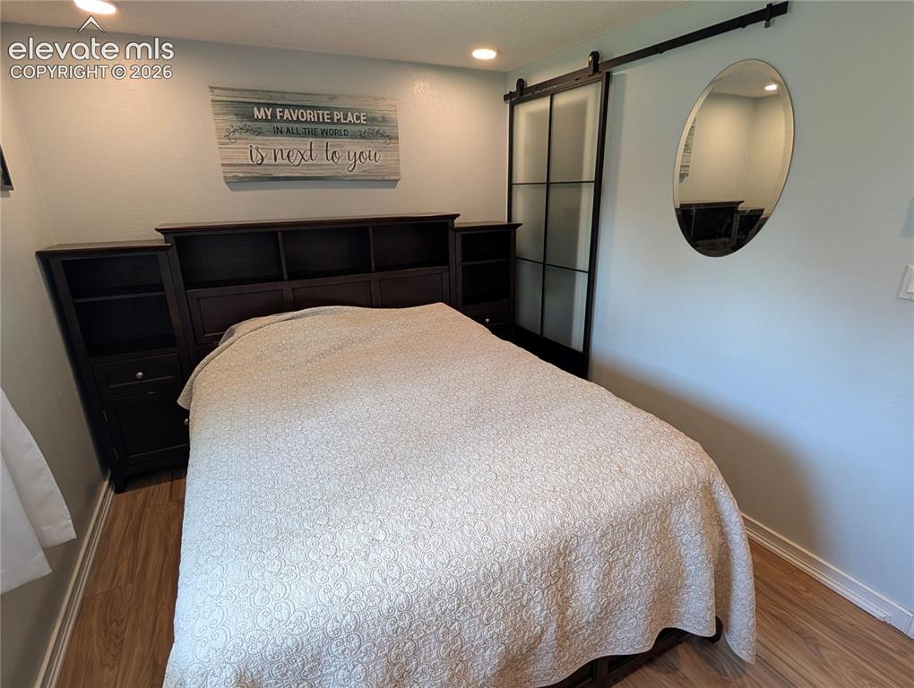Image 8 of 20: Bedroom1 with Barn Door 