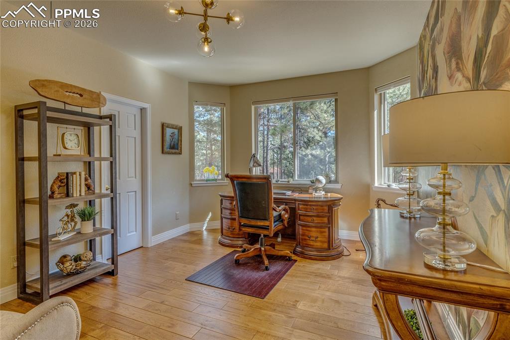 Image 12 of 50: Fabulous main level office with double doors that could be used as a bedroo