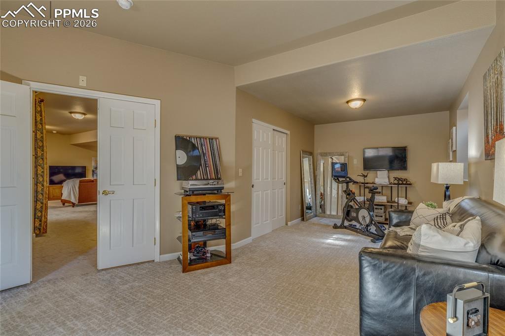 Image 31 of 50: Bedroom has double doors.