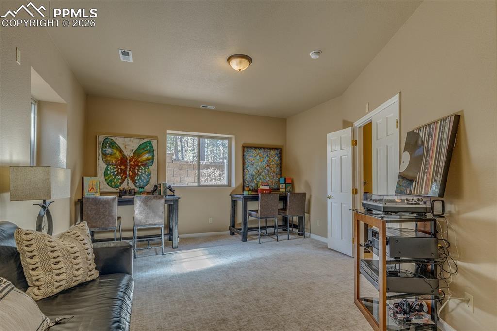 Image 32 of 50: Enjoy your views of the backyard from the bedroom.