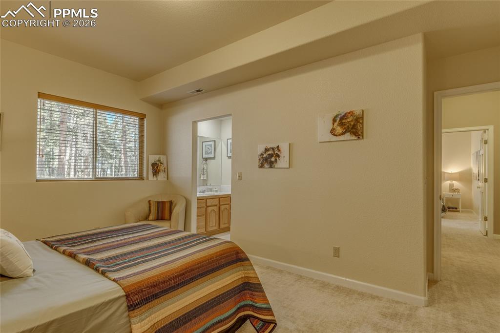 Image 35 of 50: Bedroom has its own private vanity and sink area