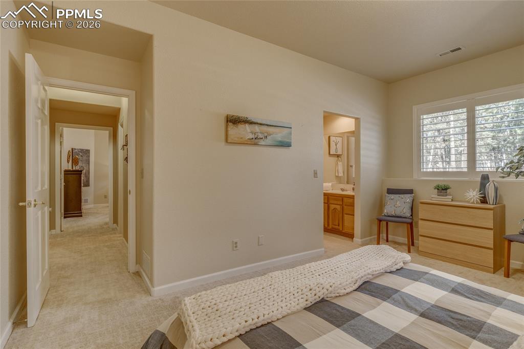 Image 38 of 50: Hallway connects the two bedrooms.
