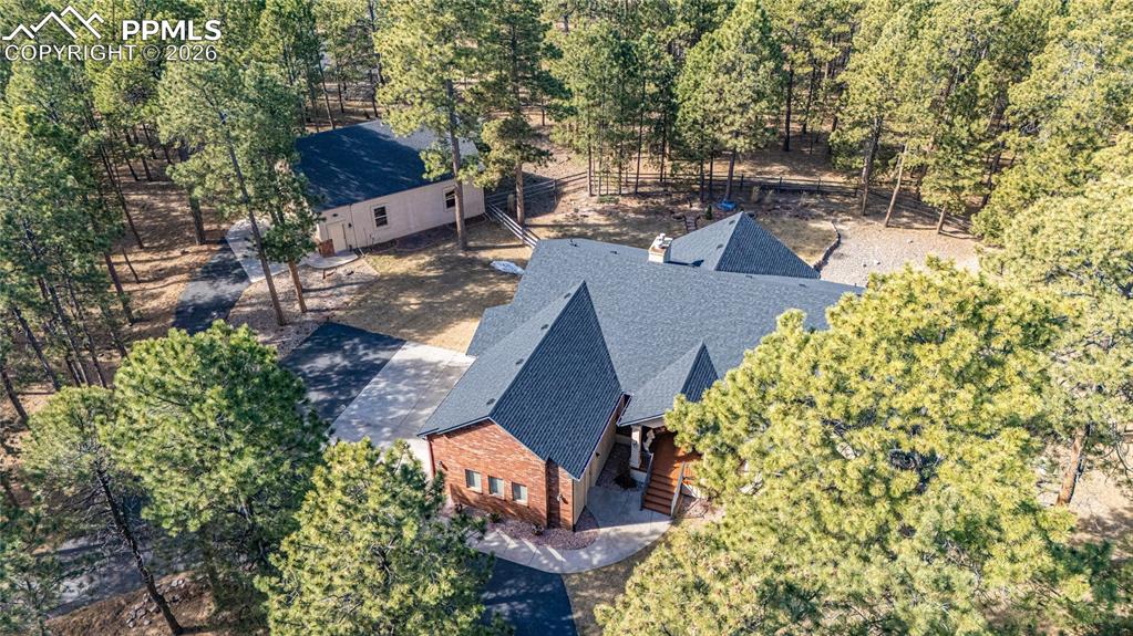 Image 46 of 50: Part of the circular driveway showing the walking path to the detached stru