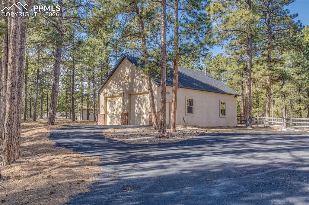 Image 47 of 50: Heated 40 x 60 detached garage with two 10-foot doors.