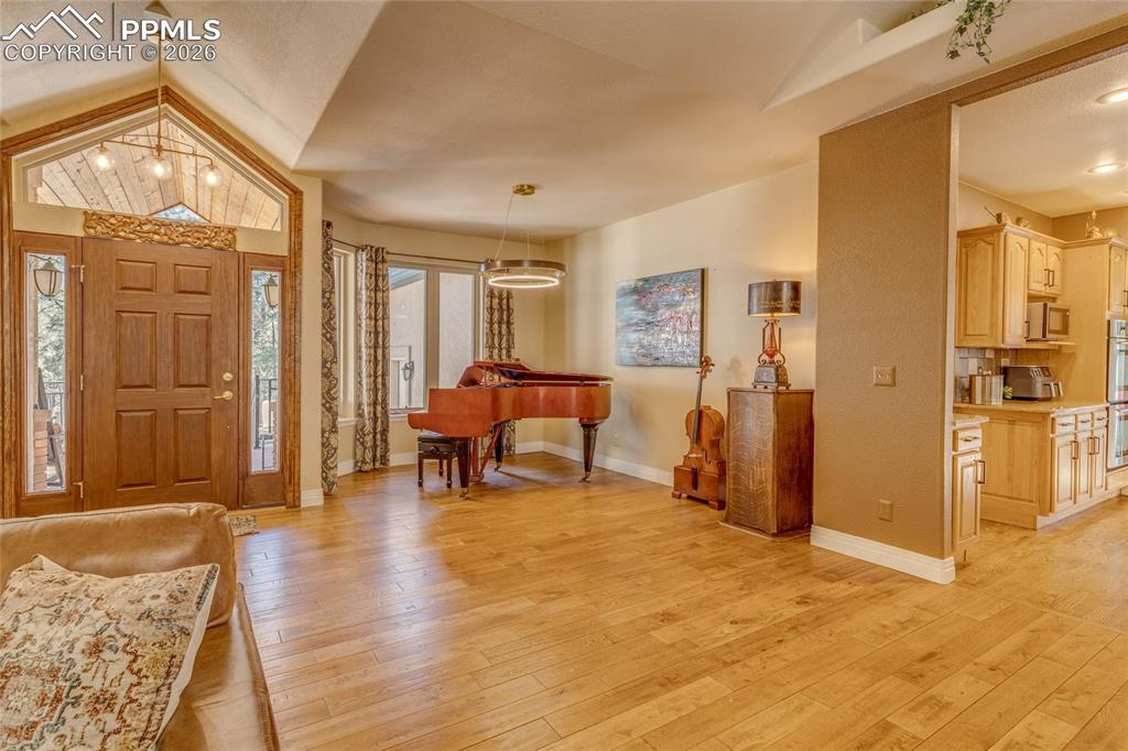 Image 6 of 50: From the living room you can see the entry and music area and the beautiful