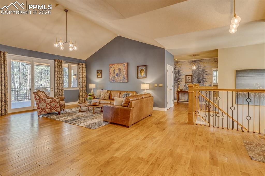 Image 8 of 50: Very large open Living Room with lots of windows and door to enjoy the back