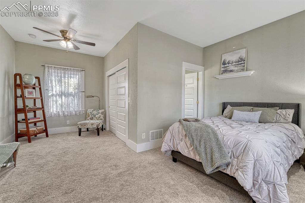 Image 2 of 46: Main level bedroom with ensuite bath