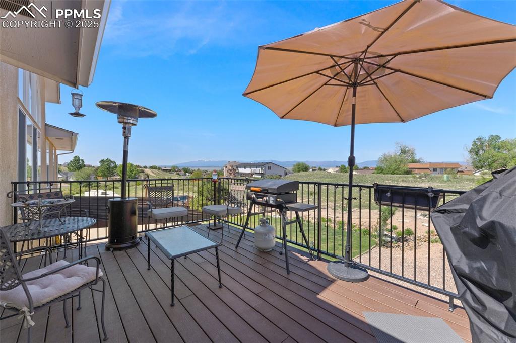 Image 11 of 44: Composite Deck Right off the Kitchen ; Take in Mountain Views, enjoy the su