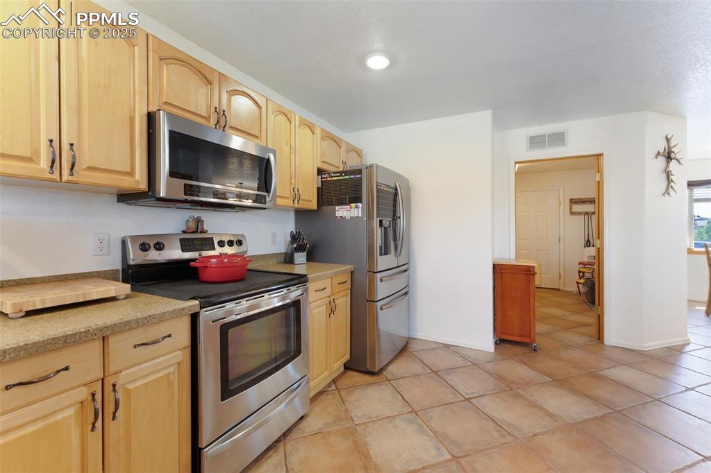 Image 14 of 44: Open Kitchen Includes Large Pantry, Breakfast Bar, Plenty of Countertop & C