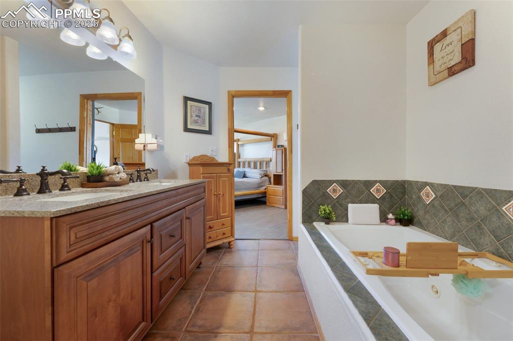 Image 19 of 44: Primary Bathroom includes Large Walk In Shower, Soaking Tub and Dual Vanity