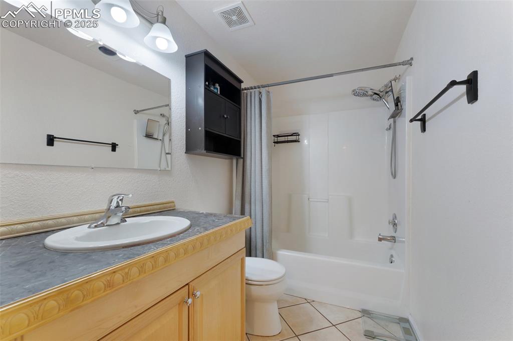 Image 28 of 44: Basement Bathroom with Heat Lamp