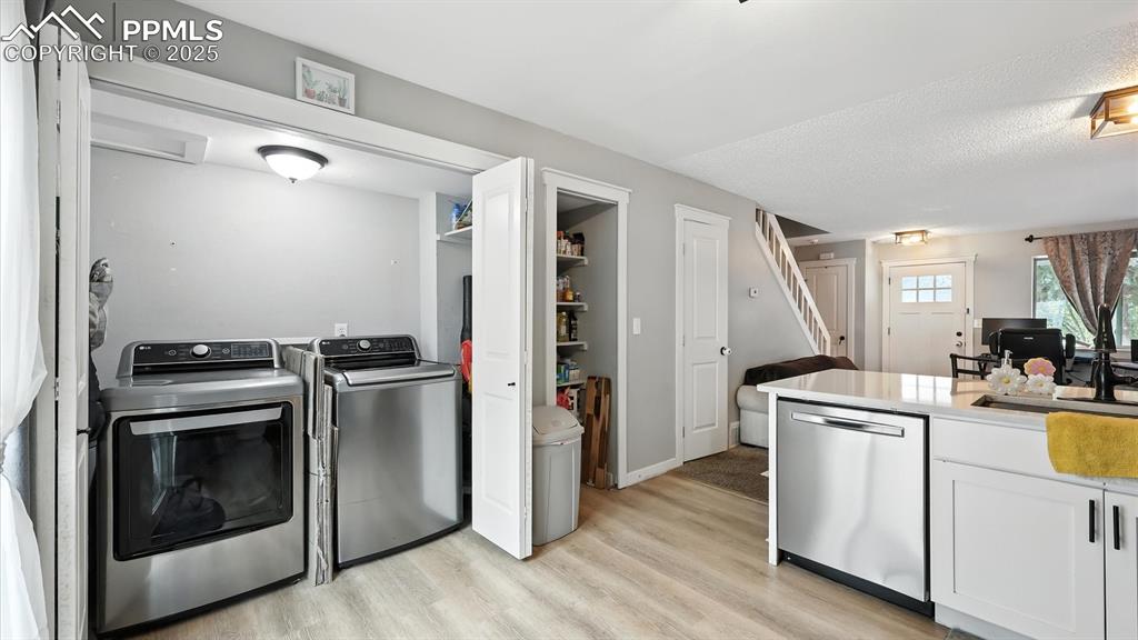 Image 10 of 29: Convenient laundry closet with electrical hook up.
