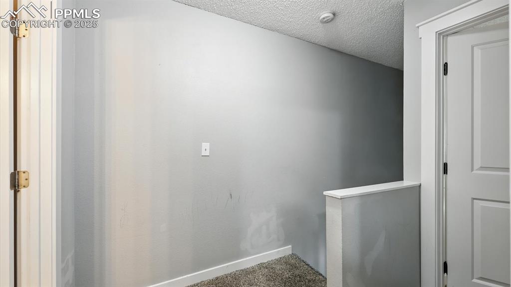 Image 16 of 29: Upper Level Hallway into the Bedrooms and Bathroom.