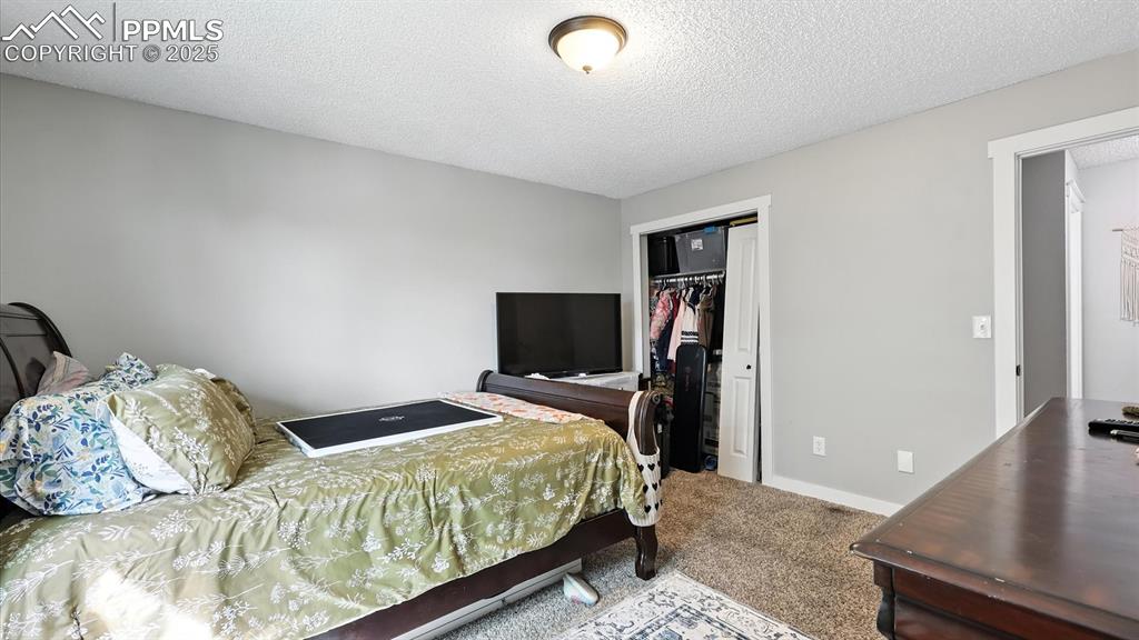 Image 20 of 29: Upper Level Primary Bedroom.