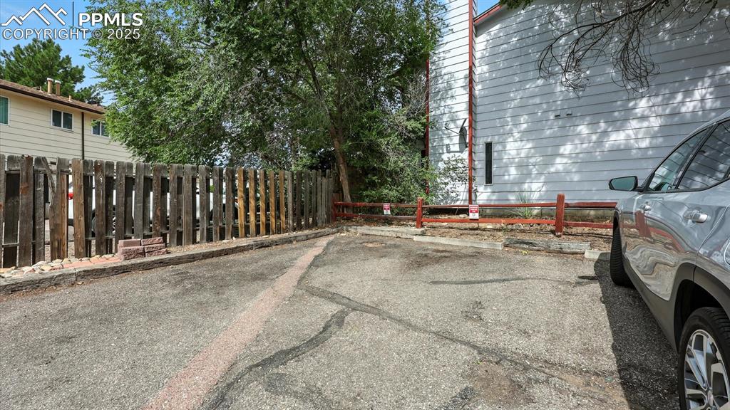 Image 23 of 29: Assigned off street parking in the back of the unit.