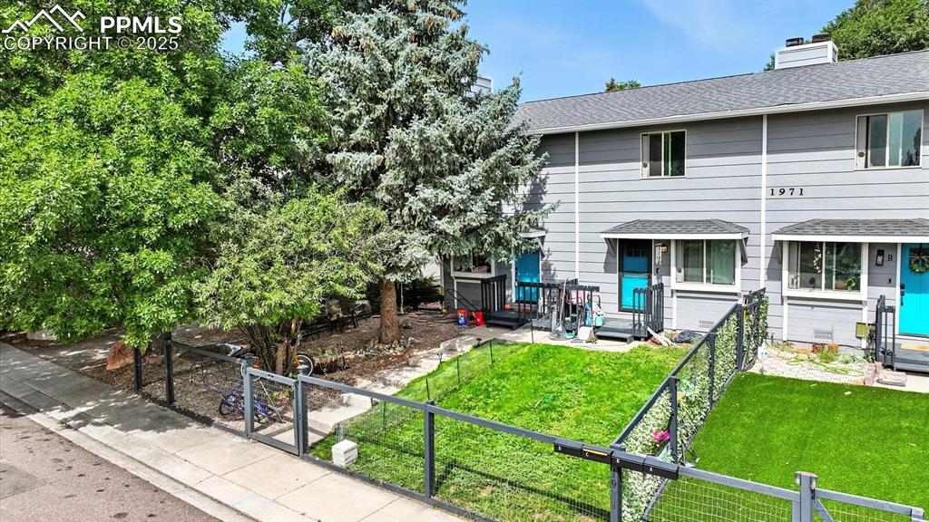 Image 25 of 29: Front view of home and lot.