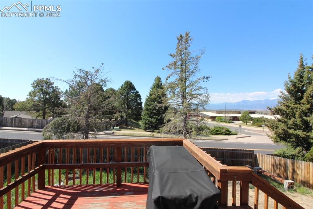 Image 11 of 14: Wooden deck with a mountain view