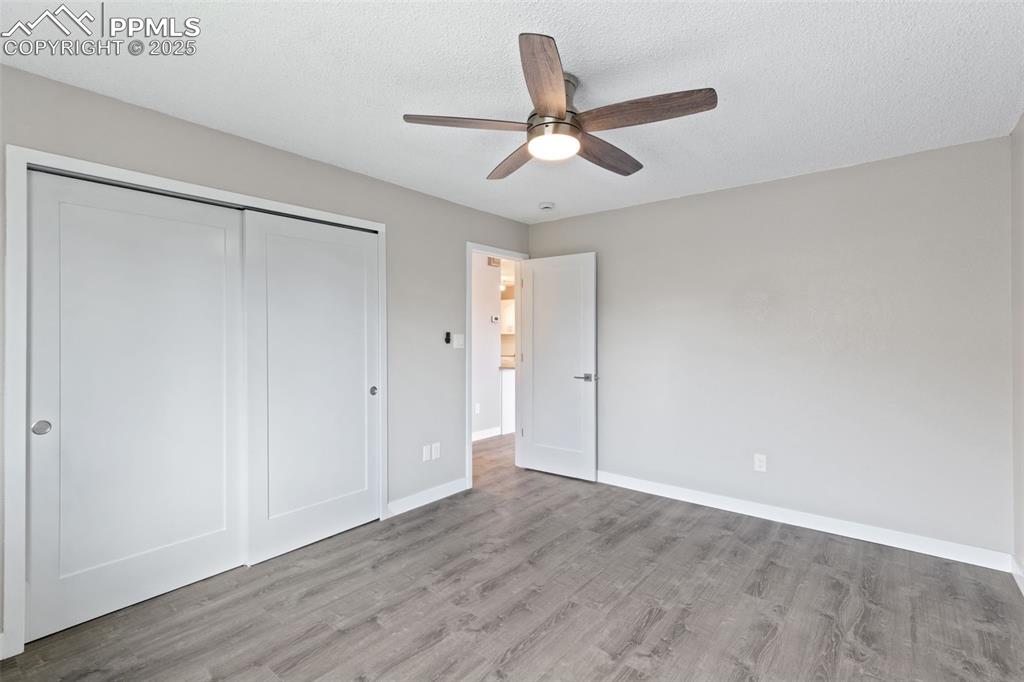 Image 13 of 15: Bedroom with ceiling fan