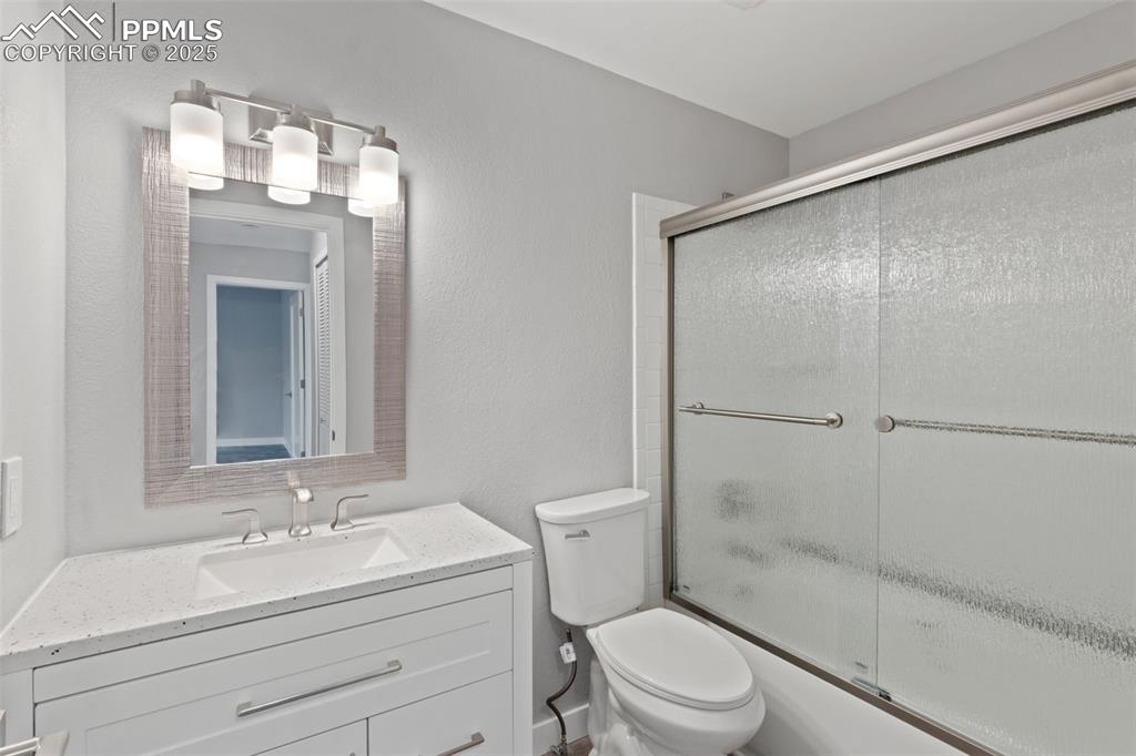 Image 14 of 15: Bright bathroom w/ step-in tub-shower 