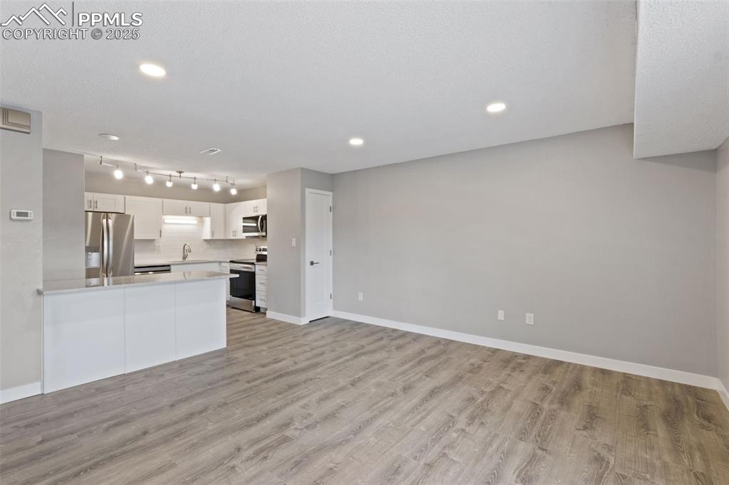 Image 4 of 15: Living room toward kitchen