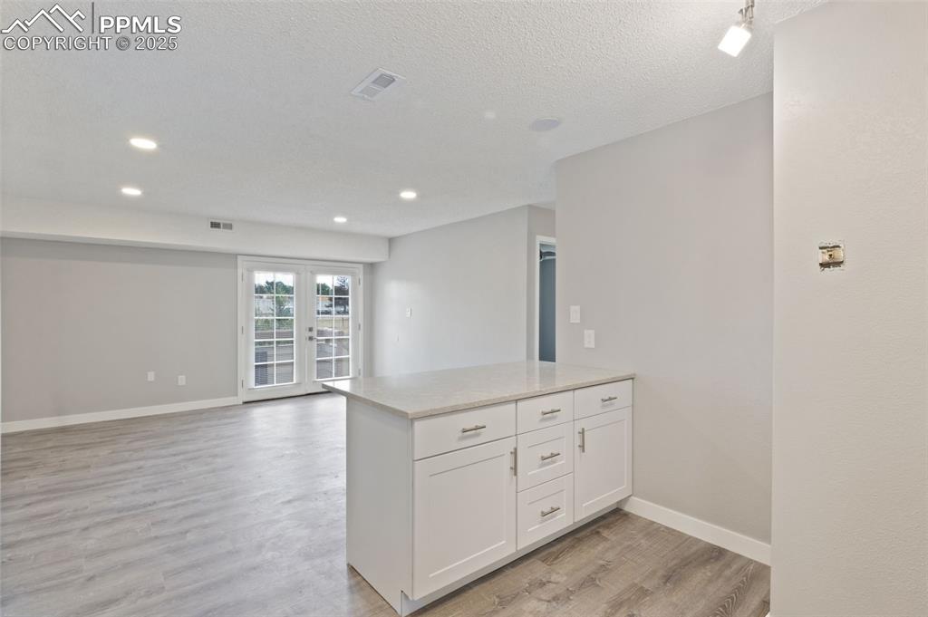 Image 6 of 15: Kitchen looking toward front door
