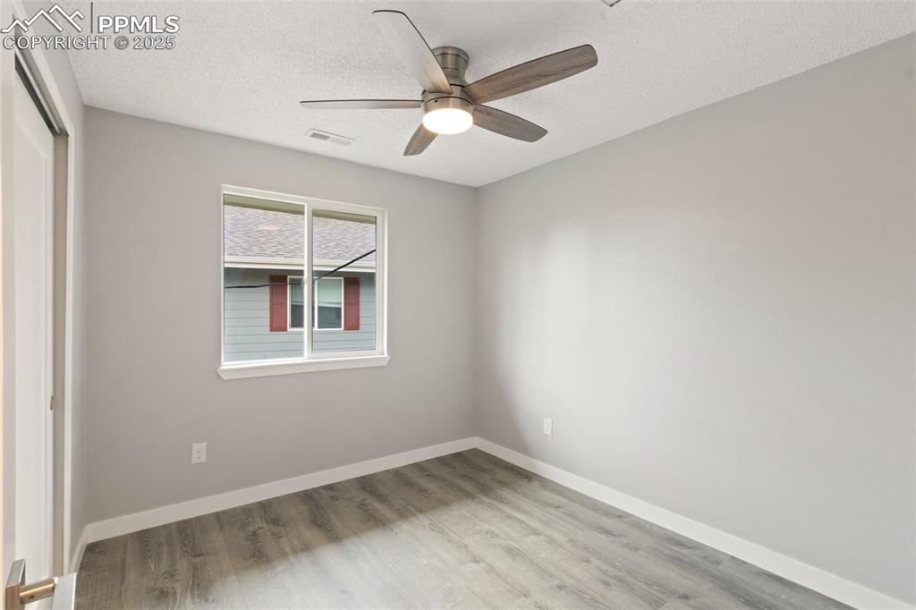 Image 9 of 15: Bedroom with ceiling fan