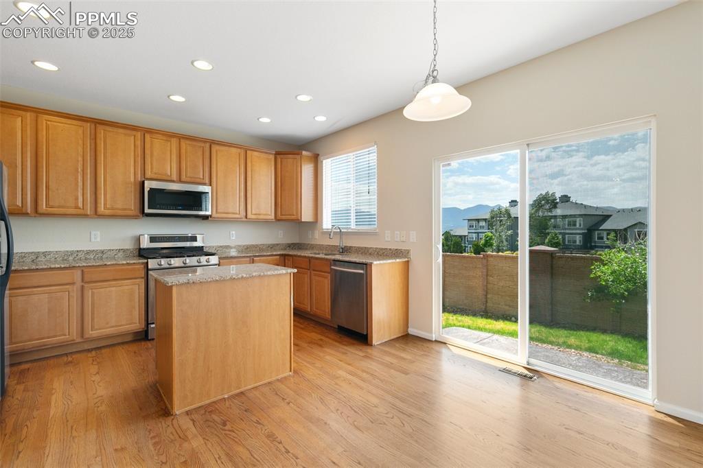Image 20 of 45: Kitchen featuring appliances with stainless steel finishes, recessed lighti