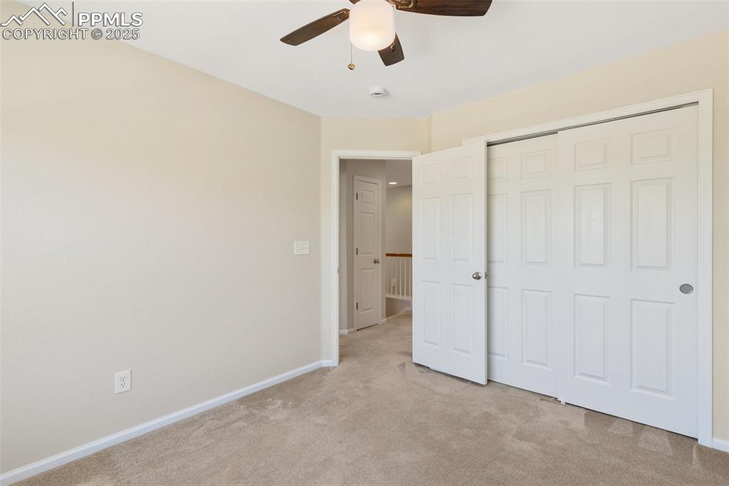 Image 30 of 45: Unfurnished bedroom featuring light colored carpet, a closet, and ceiling f