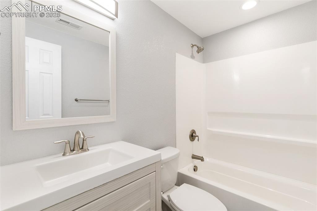 Image 39 of 45: Full bath featuring shower / tub combination, vanity, and recessed lighting