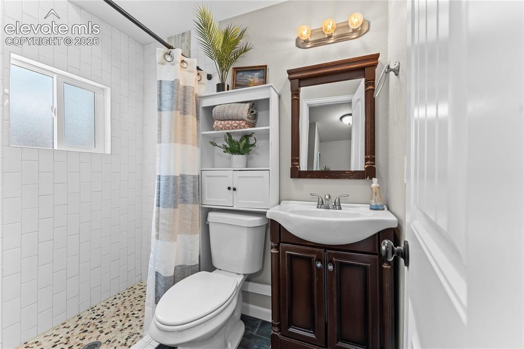 Image 10 of 22: Main level primary bathroom