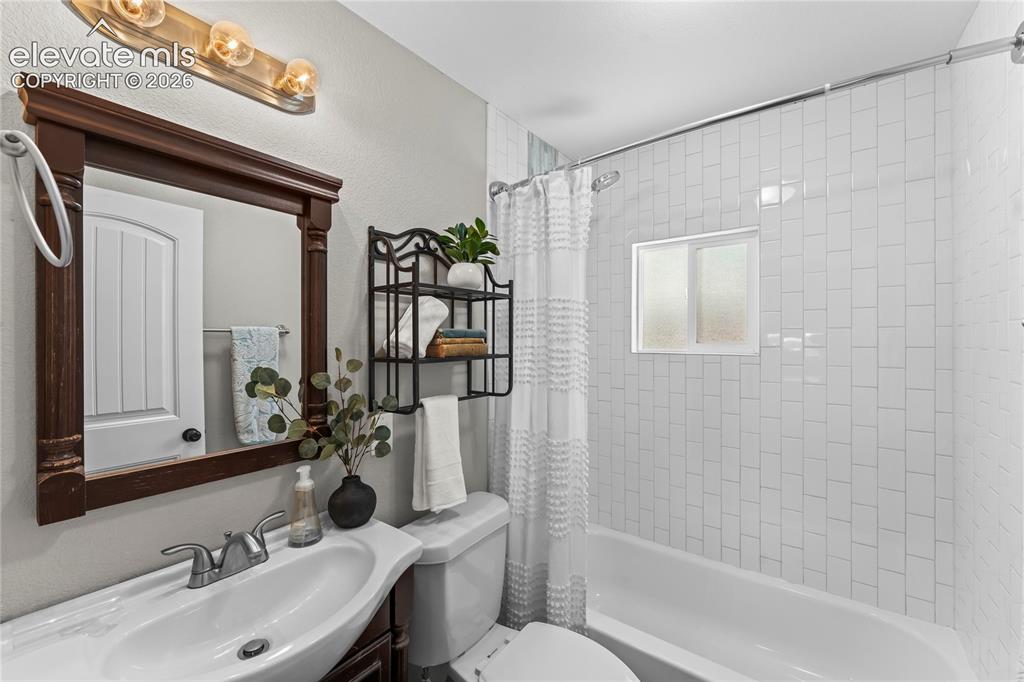 Image 11 of 22: Main level guest bathroom