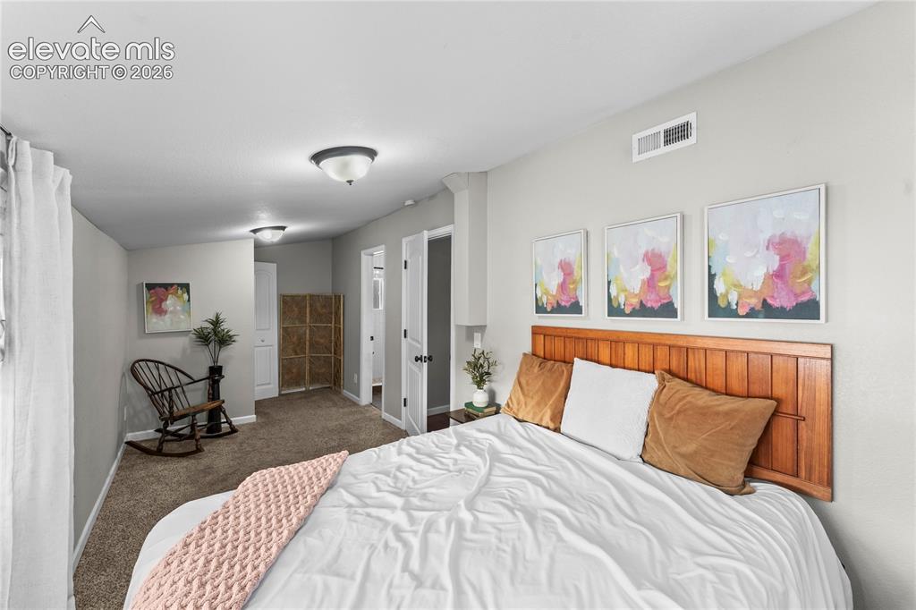 Image 8 of 22: Main level primary bedroom