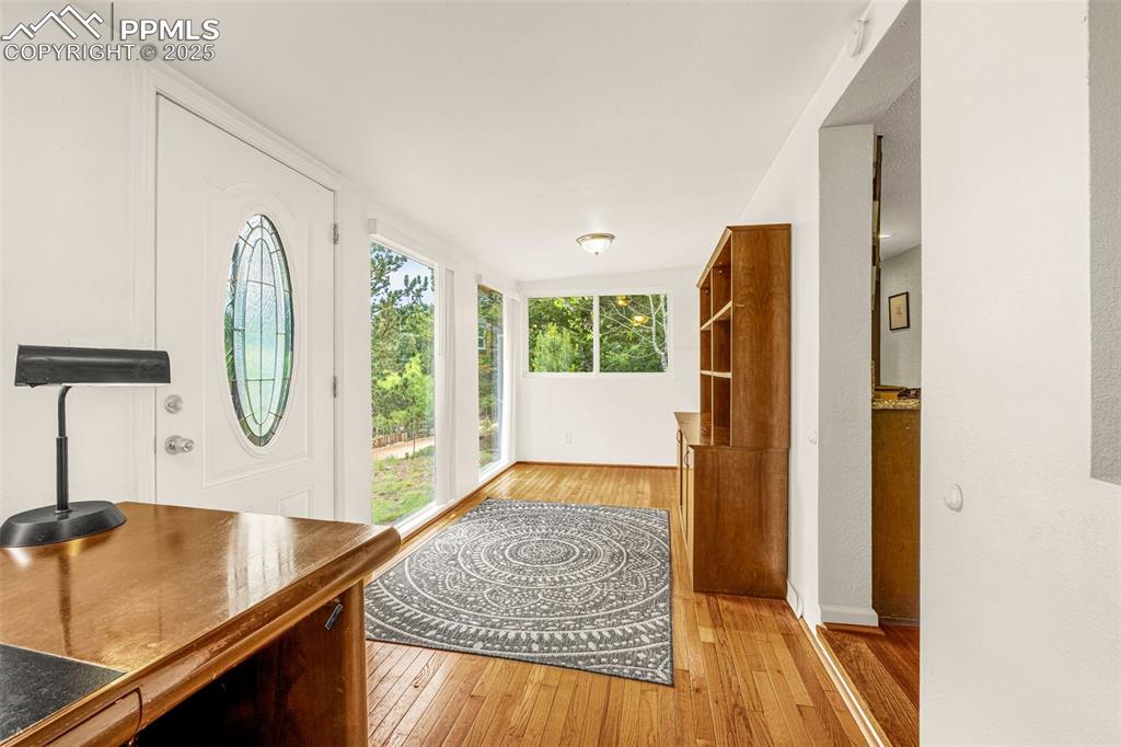 Image 2 of 31: Entryway with light wood-type flooring