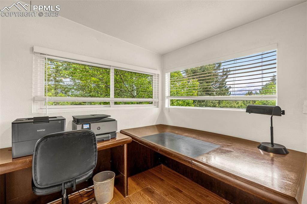 Image 5 of 31: Office area with wood finished floors