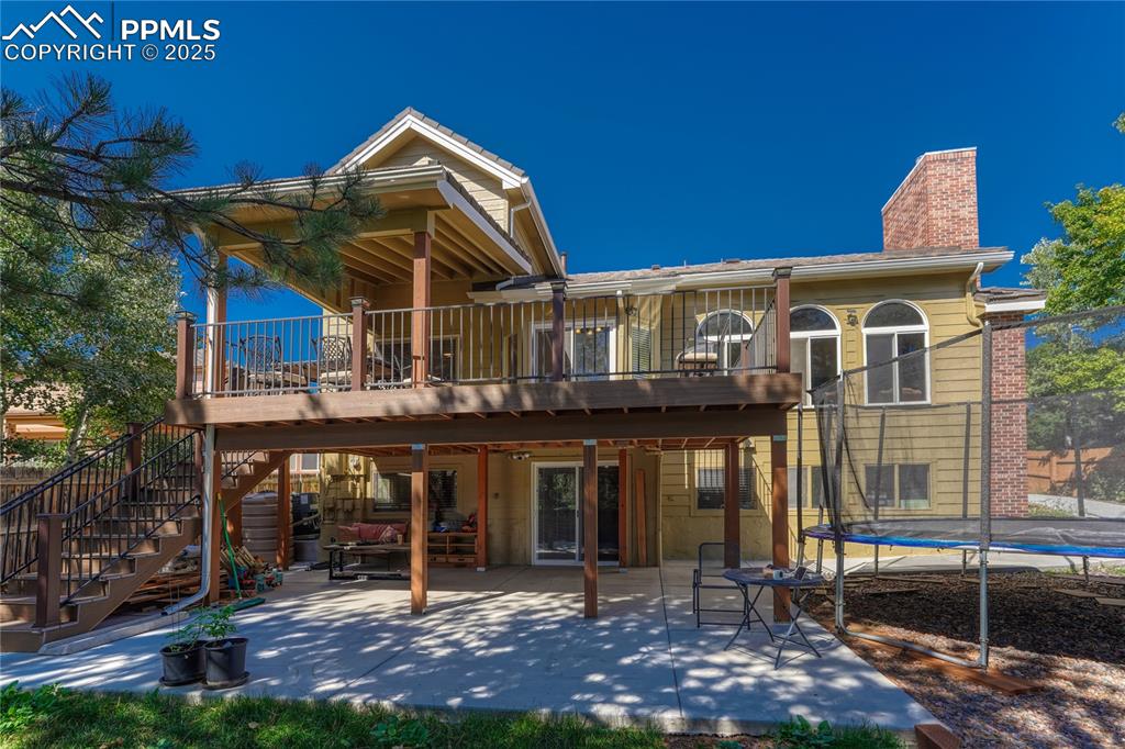 Image 25 of 31: Wooden terrace featuring outdoor dining area