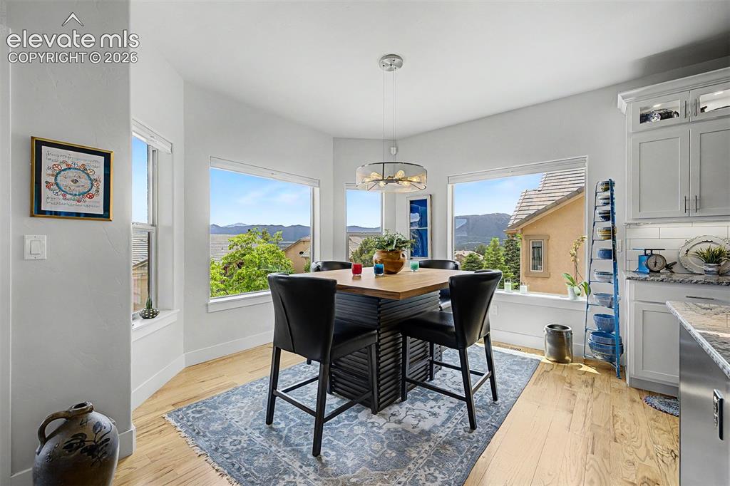 Image 12 of 49: Though shown with a 4-seat dining table, this area is definitely large enou