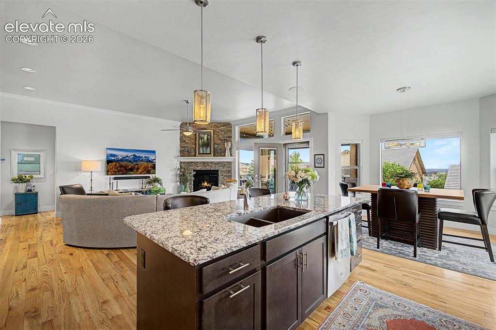 Image 17 of 49: Large open space, with beautiful hardwood floors and a floor to ceiling fir