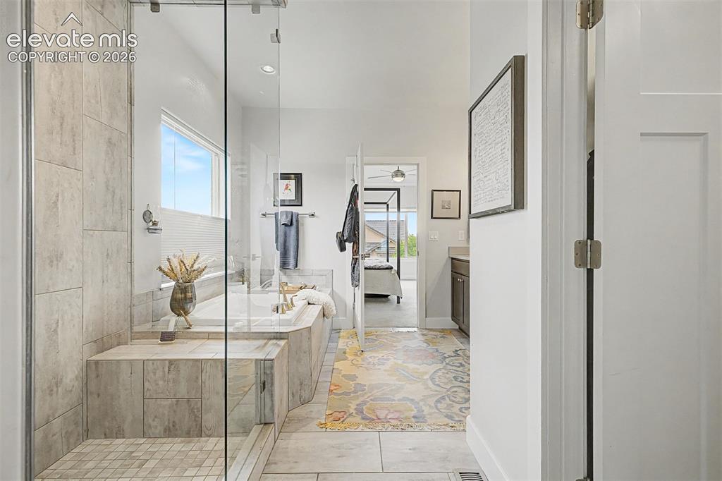 Image 26 of 49: Another view of the gorgeous shower and large, soaking tub.
