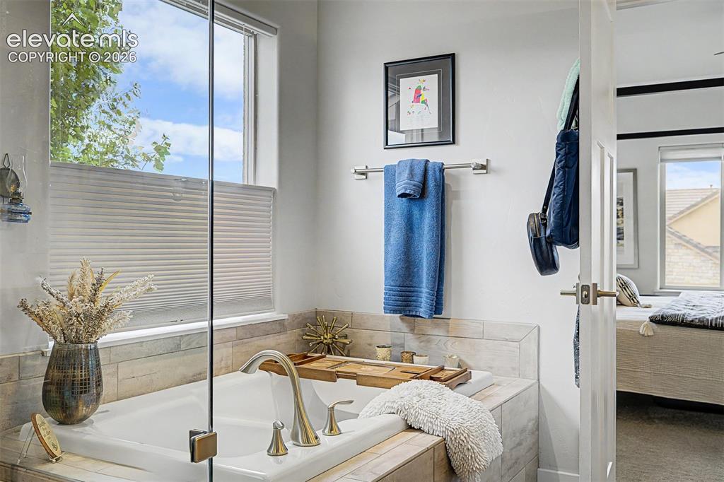 Image 27 of 49: Top-down custom shades for privacy and plenty of natural light to set the m