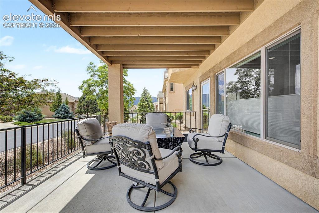 Image 39 of 49: Another large patio that extends the living space with great mountain views