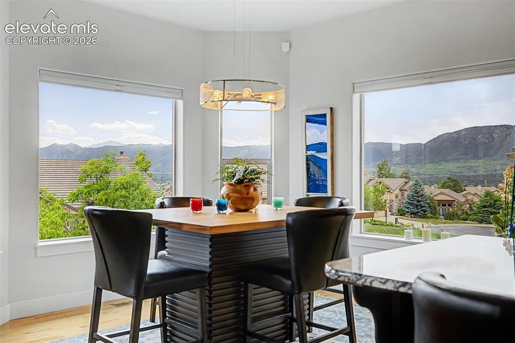 Image 9 of 49: Dining area surrounded by outstanding mountain views, including Pikes Peak!