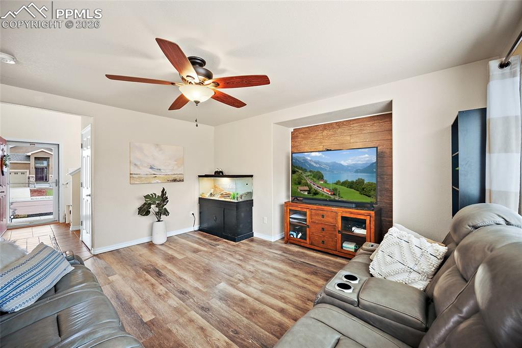 Image 11 of 43: Recessed entertainment wall with wood-finish accent paneling