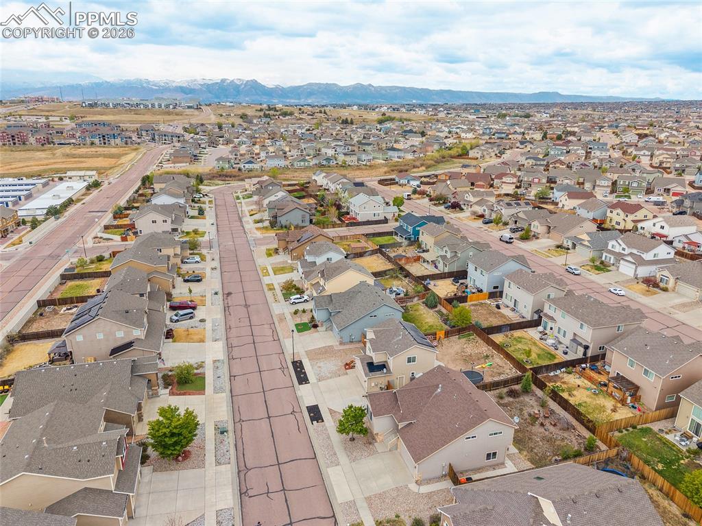 Image 33 of 43: Expansive neighborhood setting featuring numerous residential properties wi