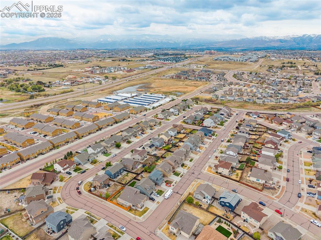 Image 34 of 43: Aerial depiction of a residential community with diverse housing styles
