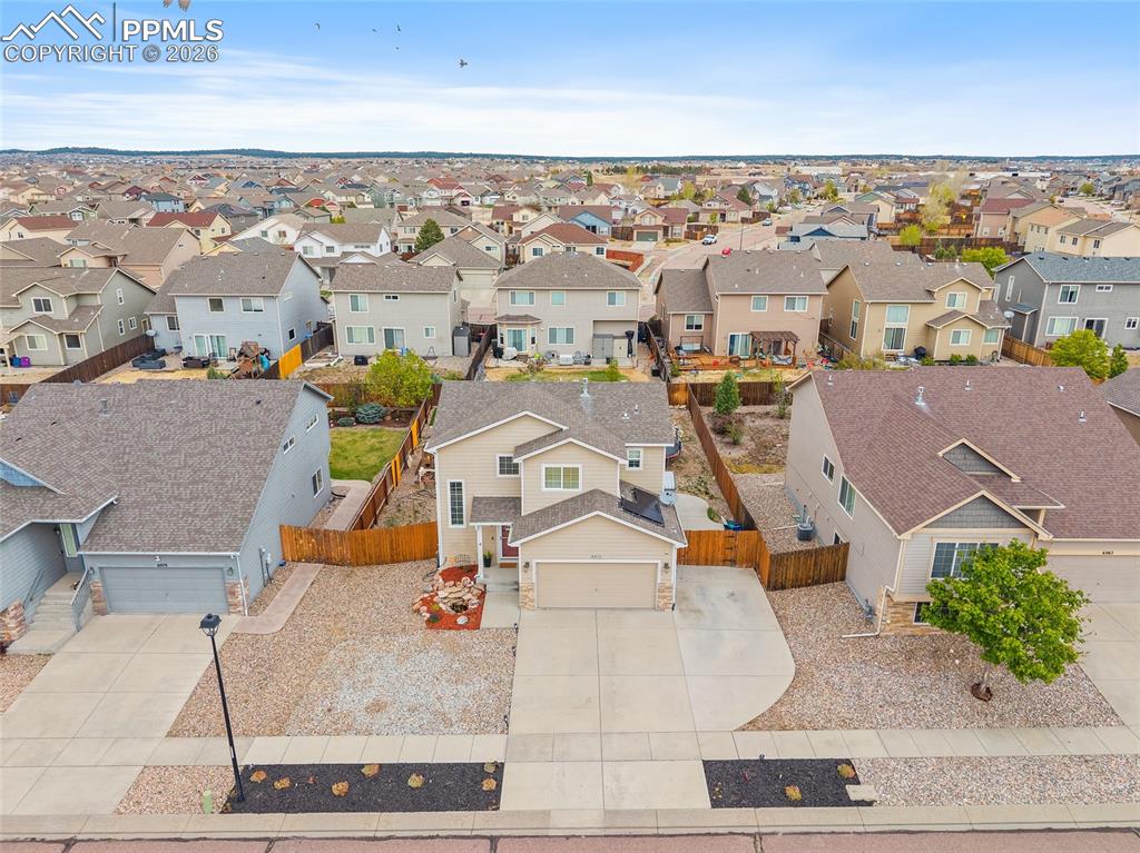 Image 35 of 43: Two-story residence featuring a two-car garage and a paved driveway