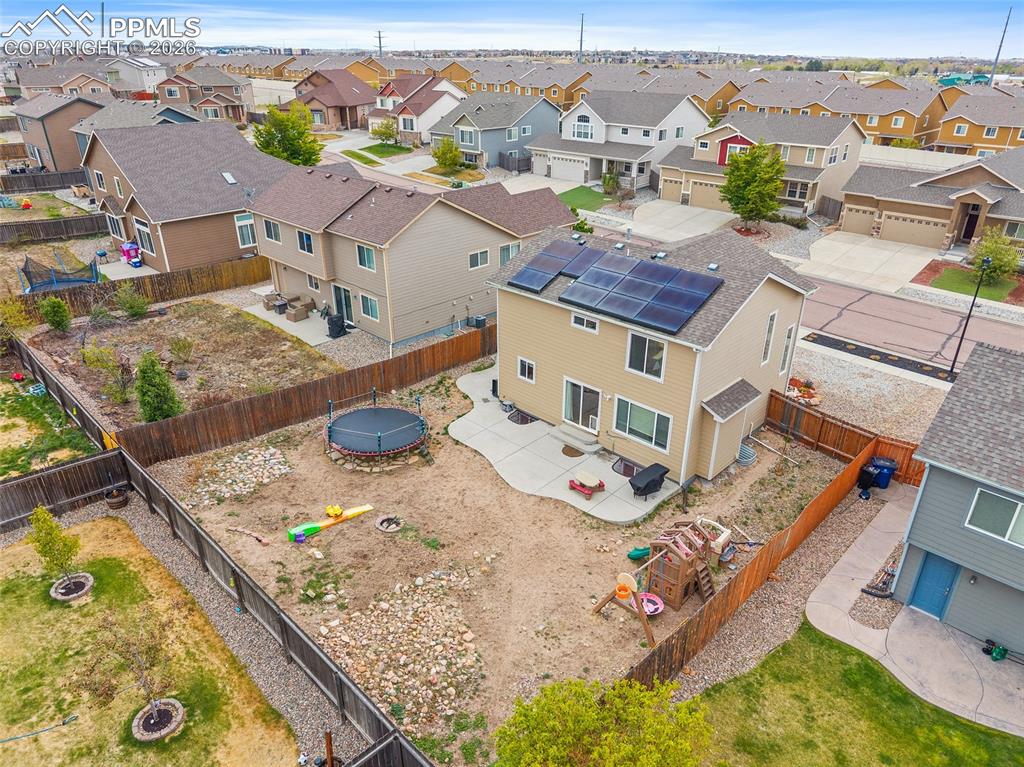 Image 37 of 43: Two-story residence featuring a neutral-toned exterior, a gabled roofline, 