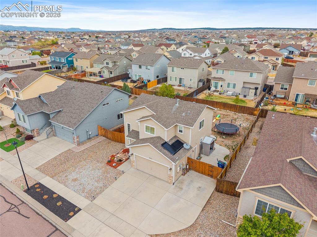 Image 38 of 43: Two-story residence featuring a two-car garage, concrete driveway, and a fe