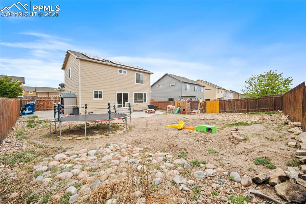 Image 43 of 43: Rear exterior featuring siding, multiple windows, and sliding glass door ac